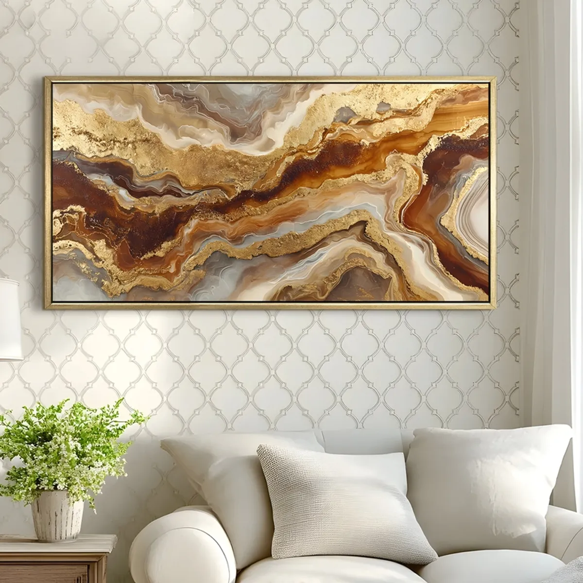 Gold-framed abstract canvas painting in earthy tones displayed on a patterned wall