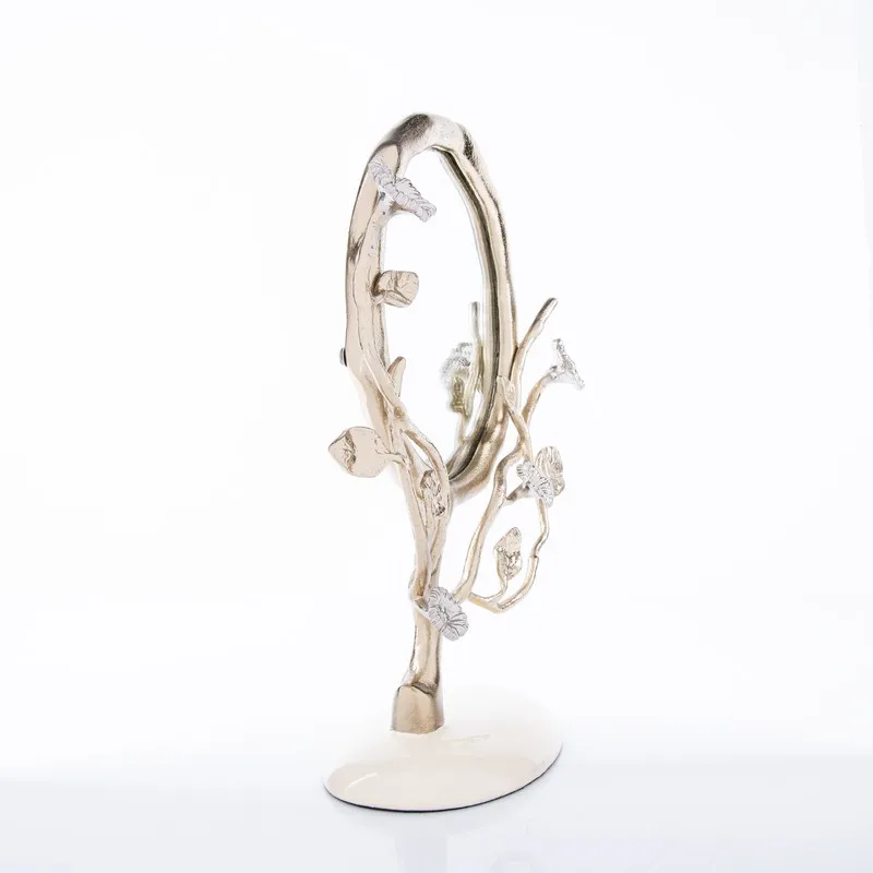 Side view showing the depth of the branching floral mirror and its oval base.
