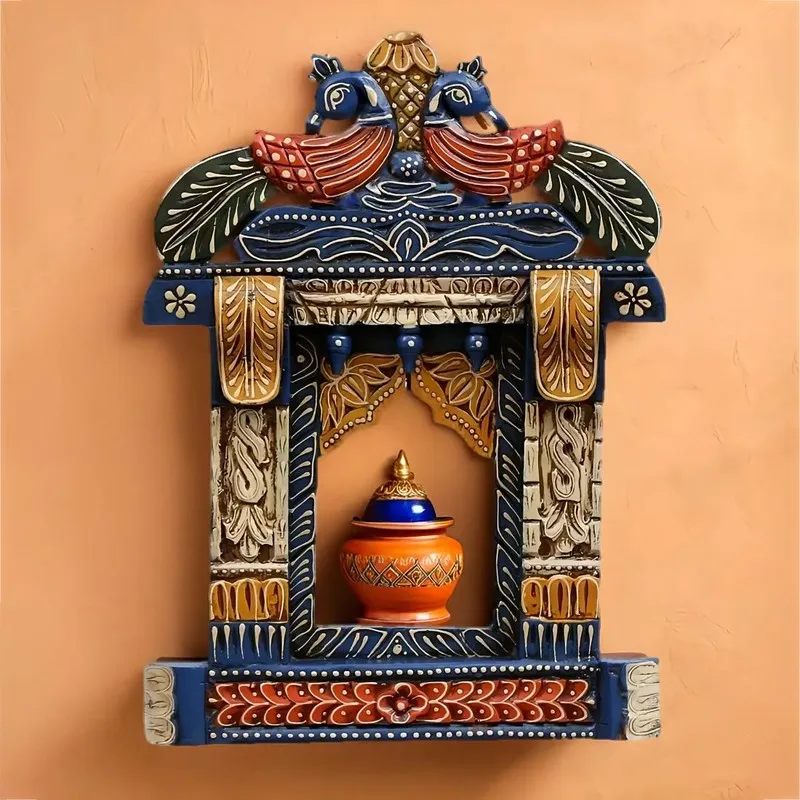 Blue carved window wall accent with bird motif and shelf-like opening