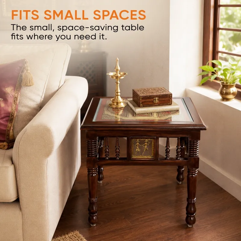 Compact square wooden side table with carved legs placed next to a sofa