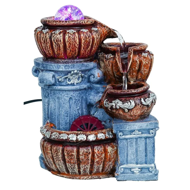Full product view of the tiered fountain with glowing purple top orb