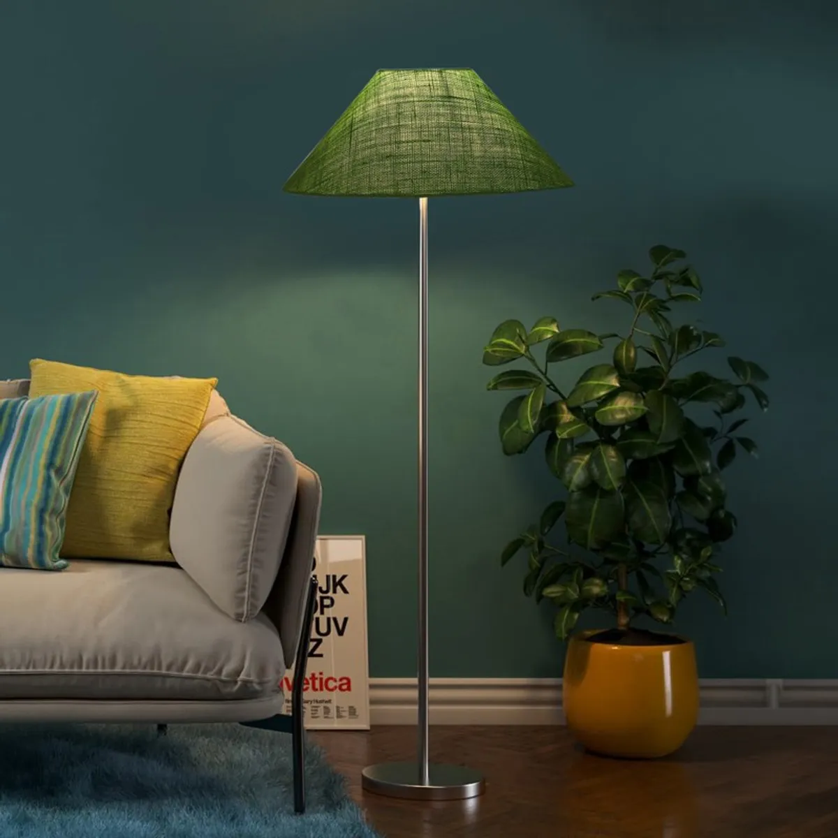Green floor lamp switched on beside a sofa and large potted plant