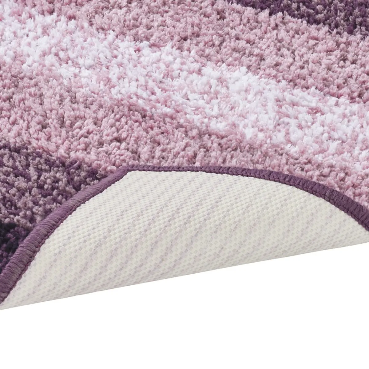 Close-up of the bath mat underside with a pale anti-skid backing