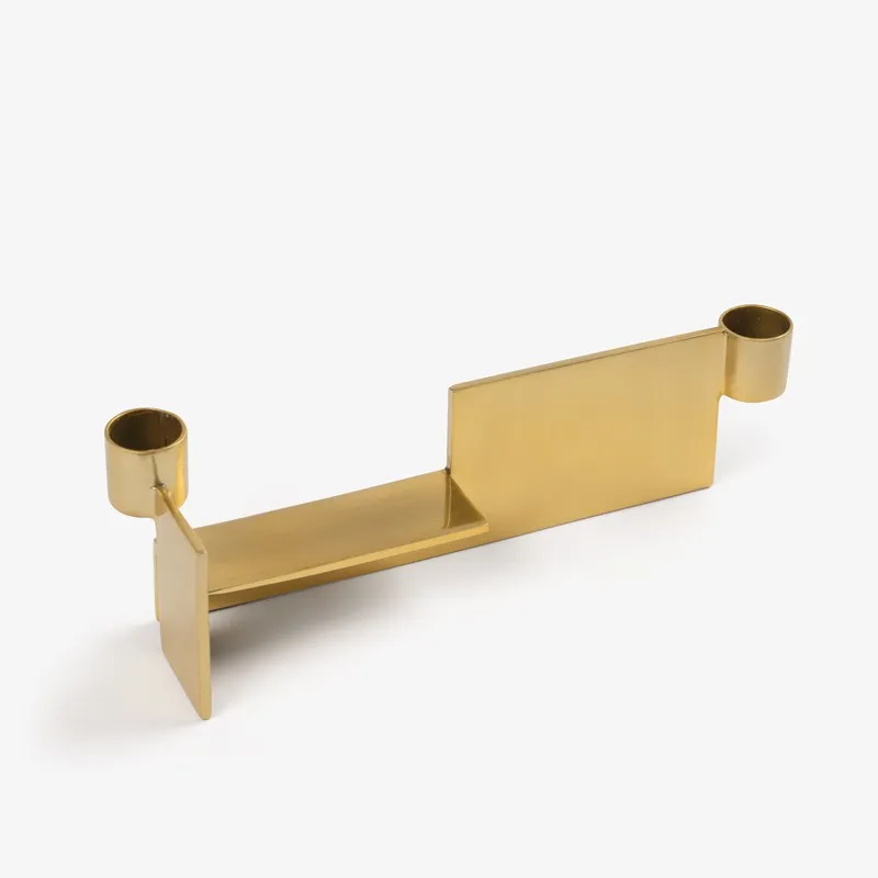 Gold stainless steel dual candle holder in an irregular geometric form