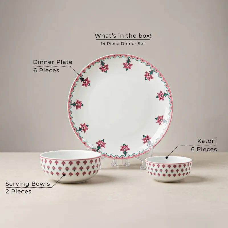 Pink and white dinner set with one large plate and two bowls displayed