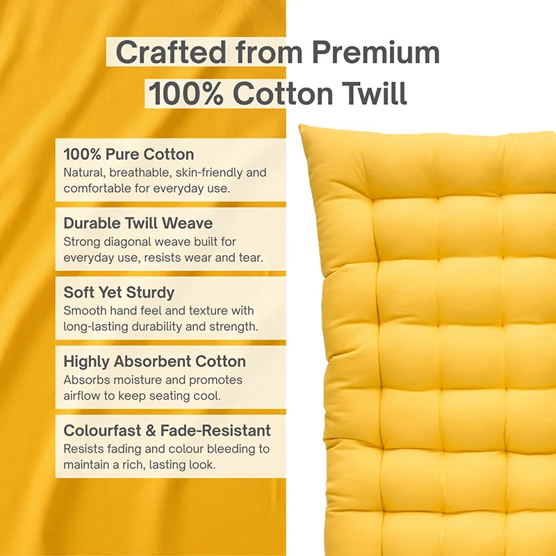 Close view of a mustard yellow tufted cushion surface