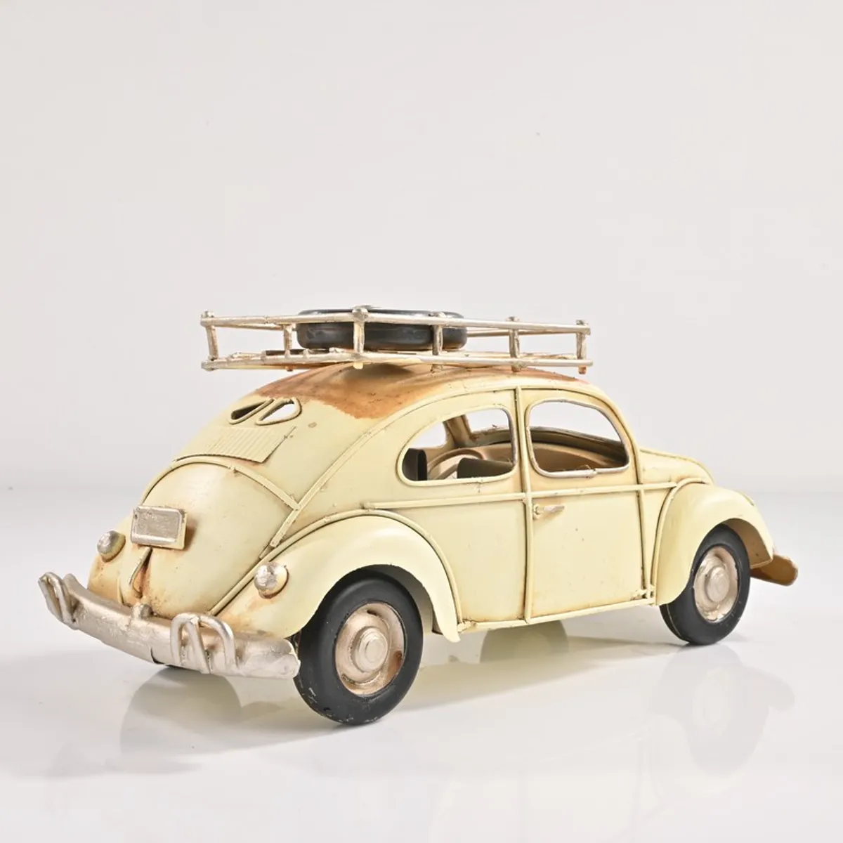 Rear angled view of the white vintage car iron showpiece