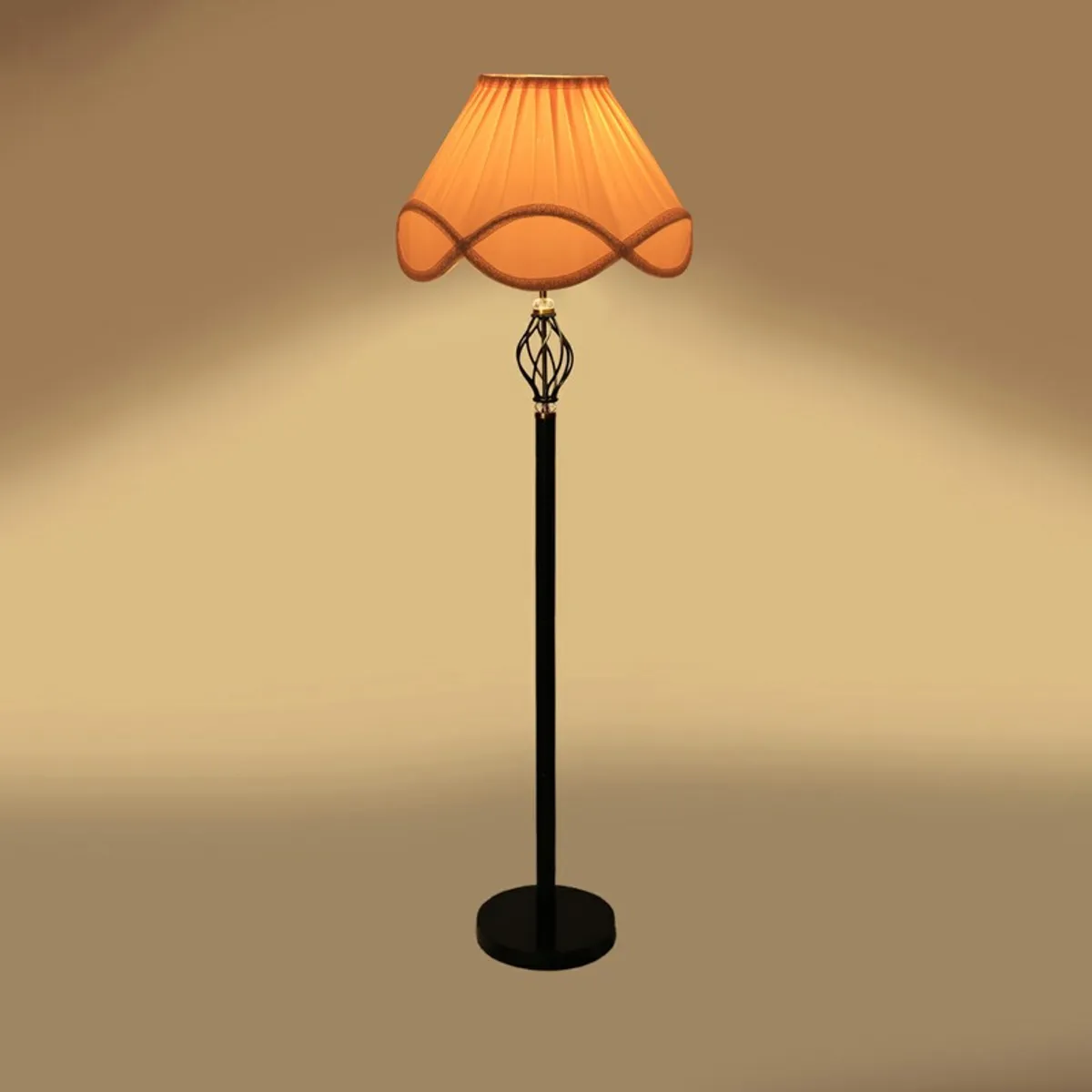 Floor lamp with warm amber glow and scalloped shade on plain background