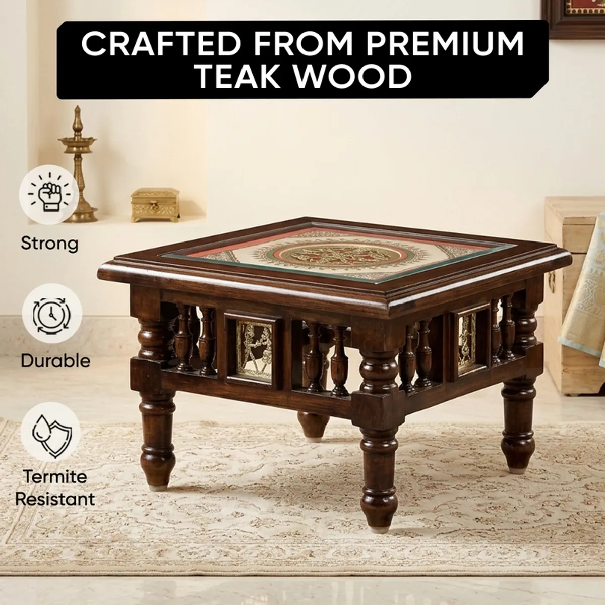 Brown teak wood side table with decorative top shown in a living room setting