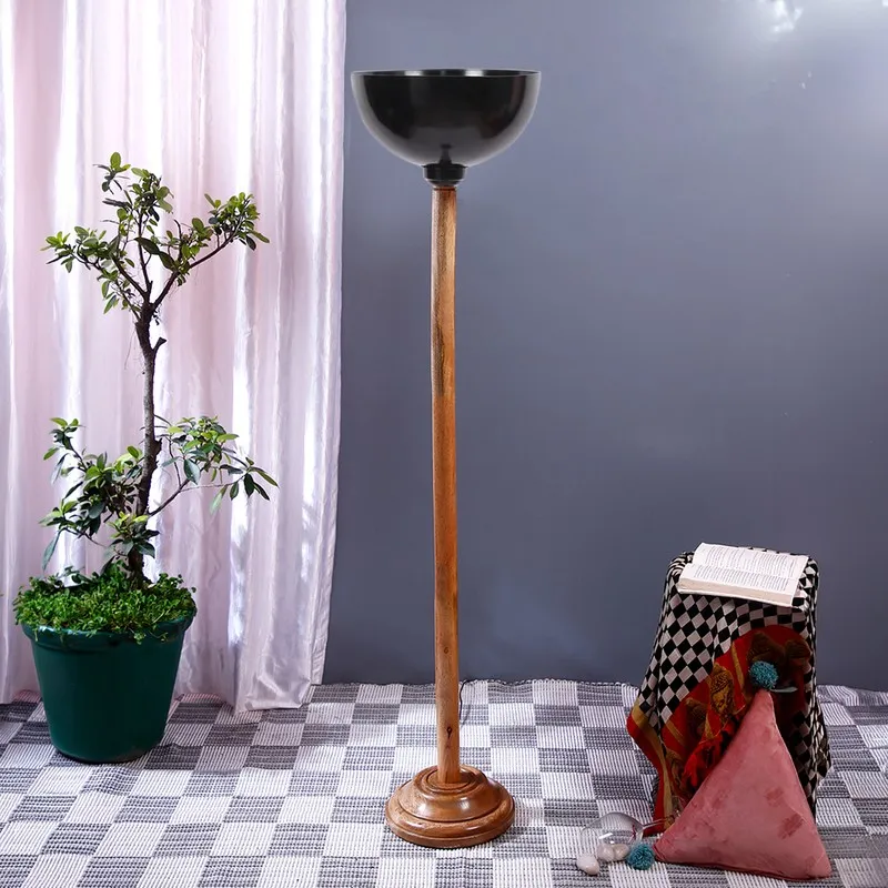 Floor lamp with glossy black bowl shade and turned wooden base