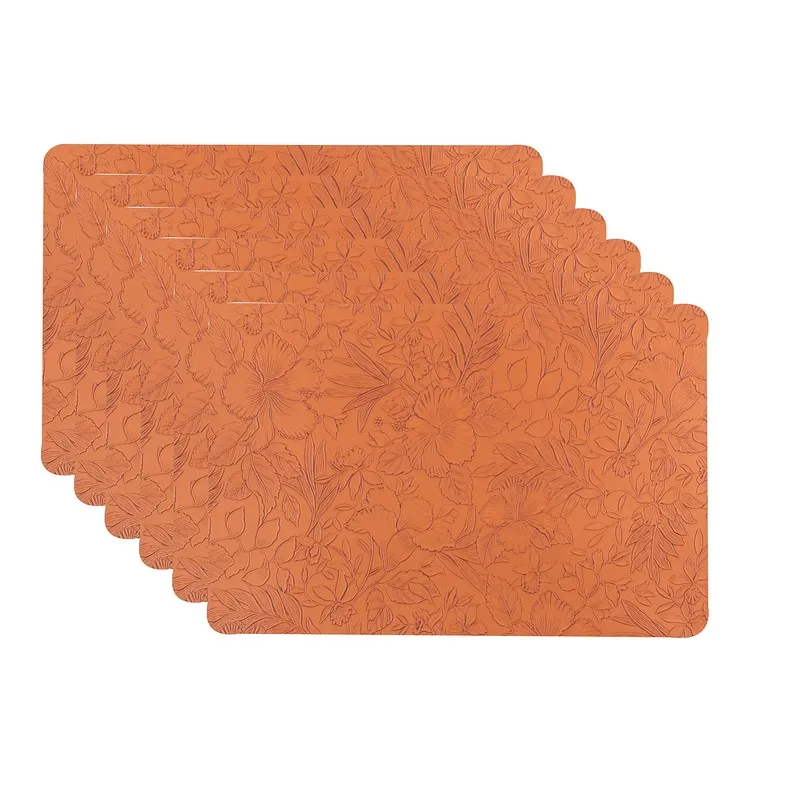 Stack of six orange rectangular table mats with floral texture