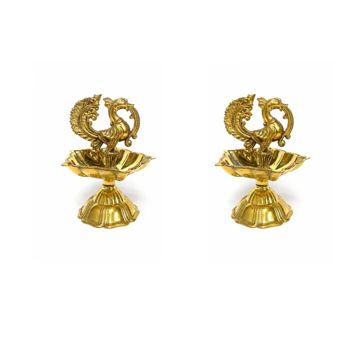 Two gold peacock brass diyas shown against a white background