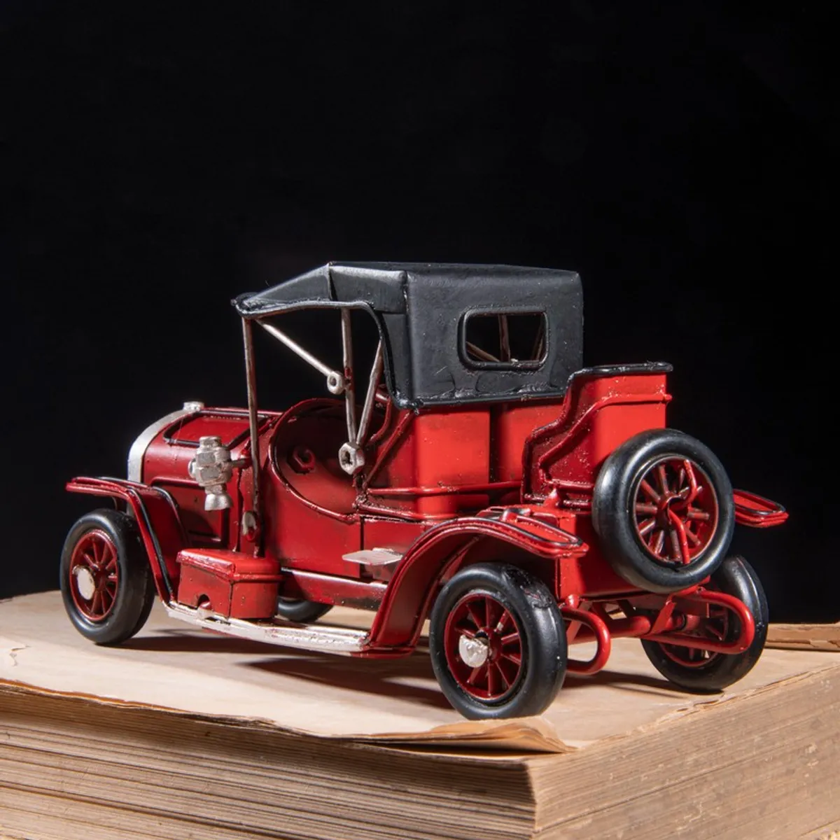 Rear angled view of red vintage car decorative showpiece
