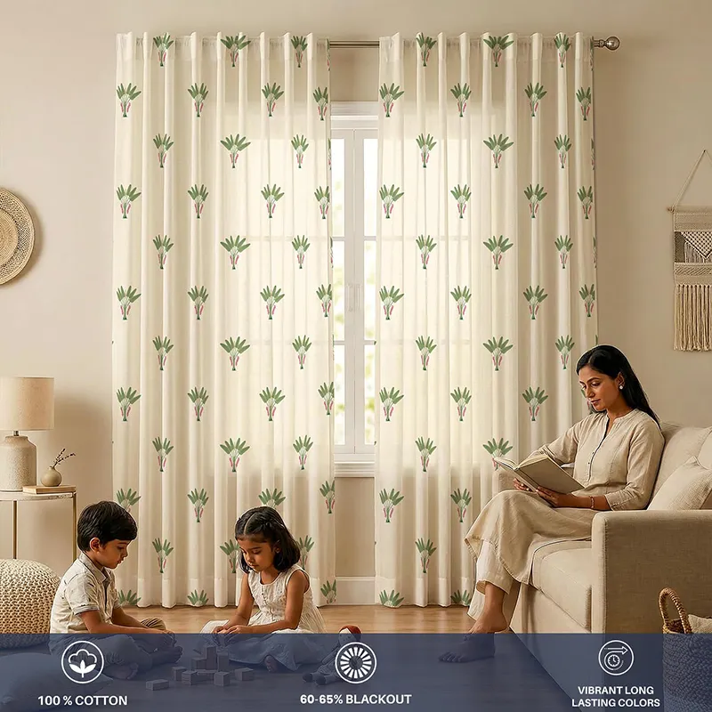Printed off-white curtains with repeating green palm motifs in a living room