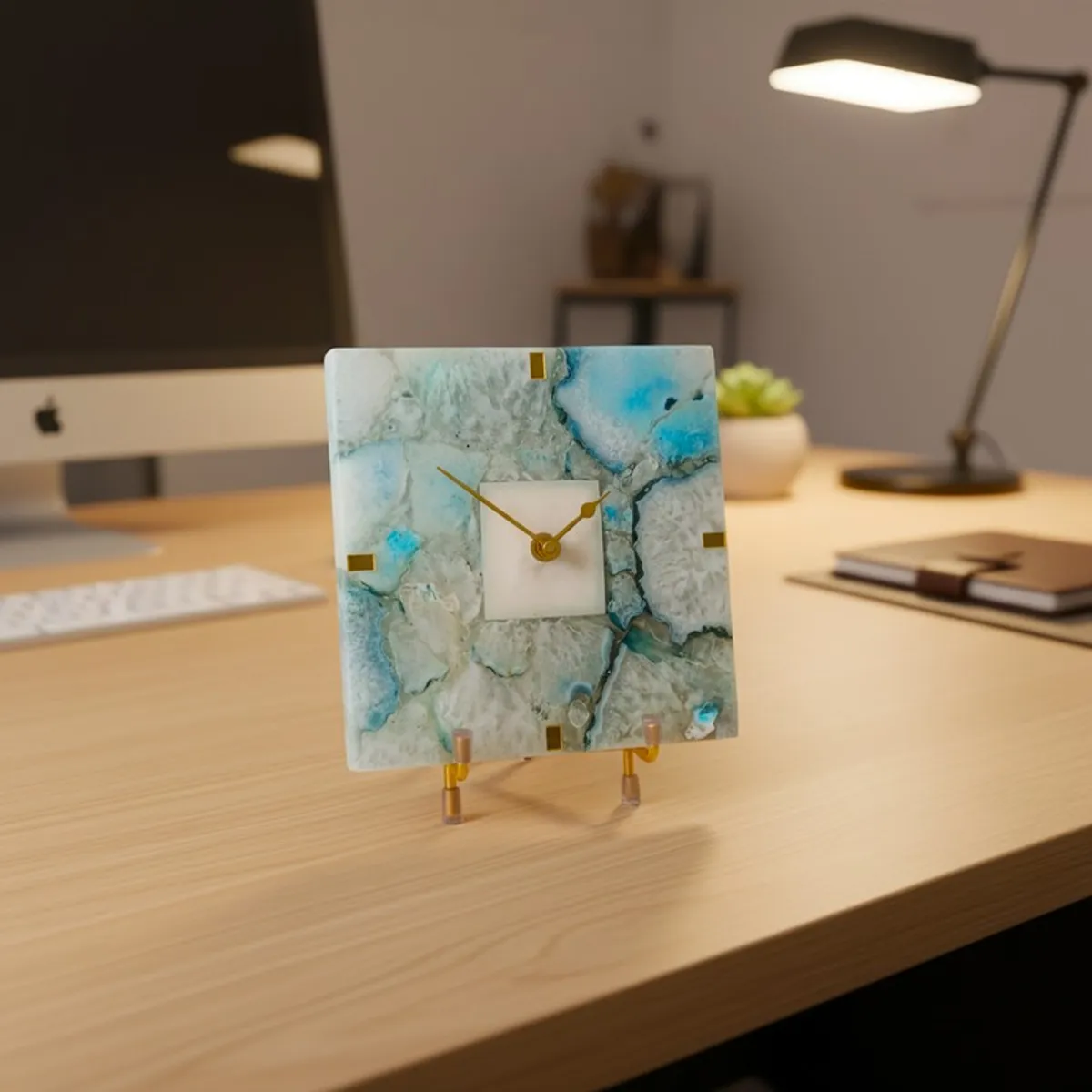 Agate table clock with blue veining styled on a desk