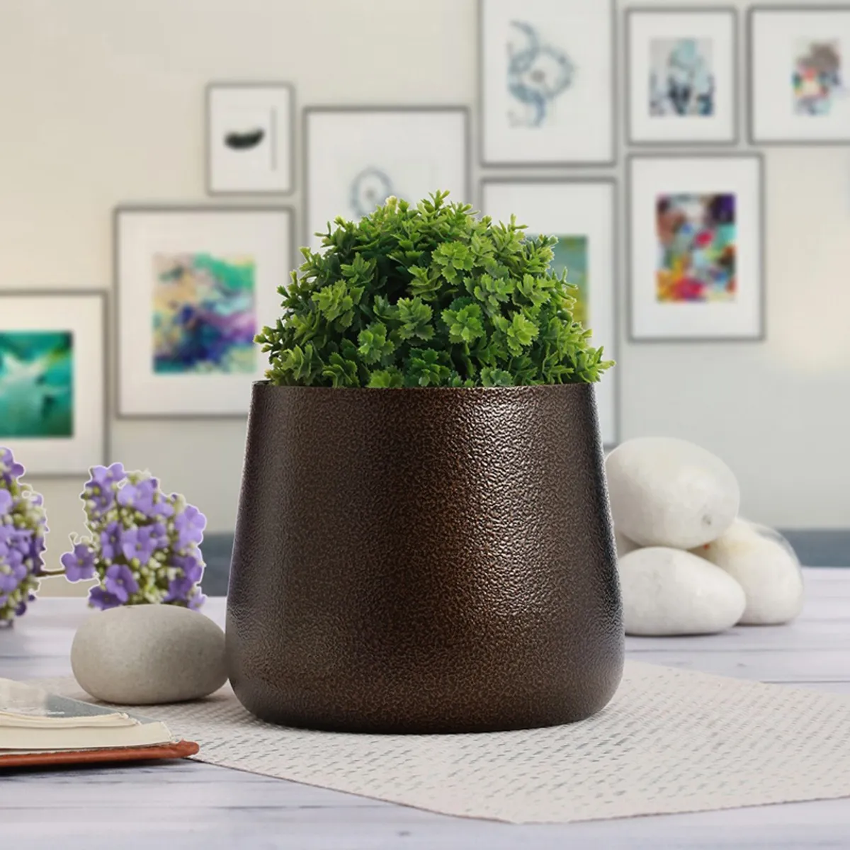 Brown textured planter holding a green plant in a bright room