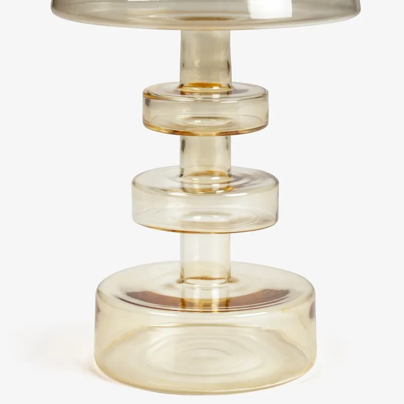 Close-up of the cylindrical amber glass base and stem