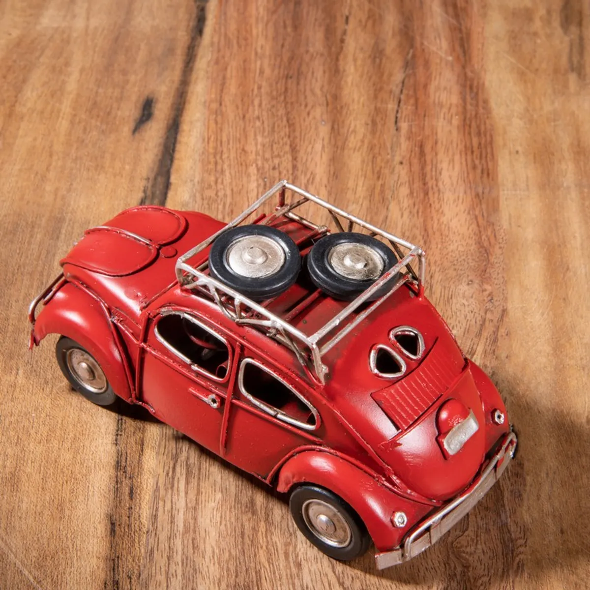 Top rear view of red vintage car iron showpiece