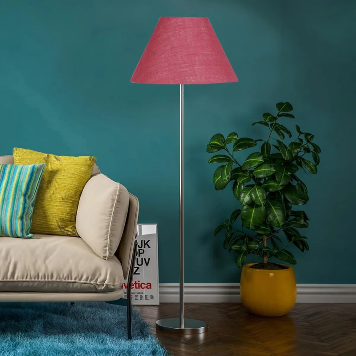 Rose blush floor lamp with slim steel stand in a teal-walled living room