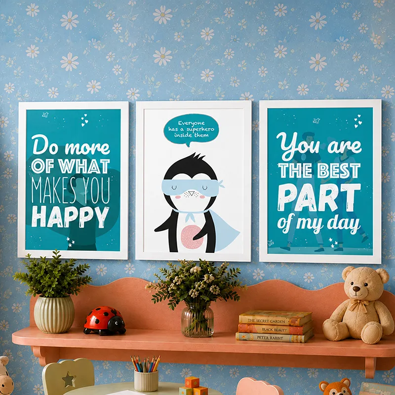 Set of three framed blue prints displayed on a blue floral wall above a peach shelf.