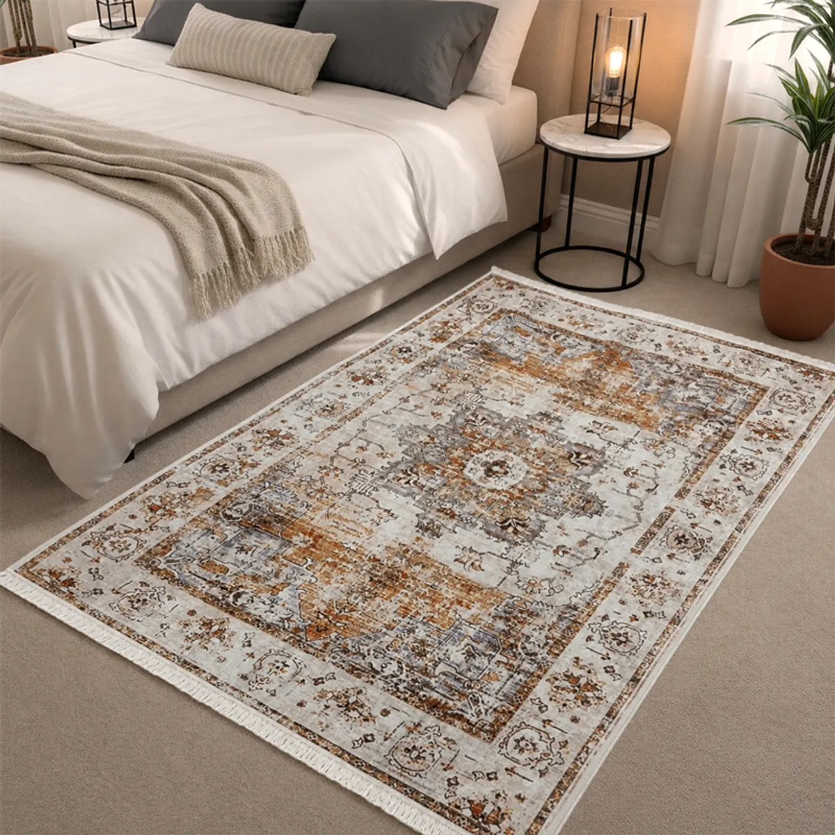 Beige ornate carpet placed beside a bed in a neutral bedroom