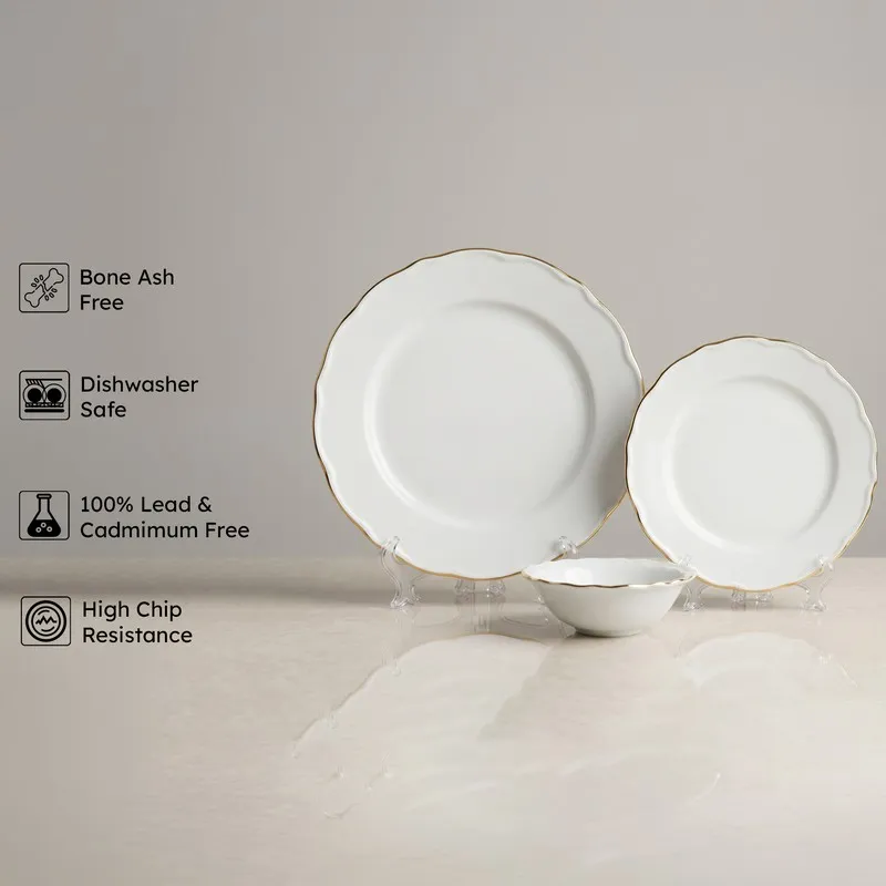 White and gold rim plate set with matching bowl on display stands