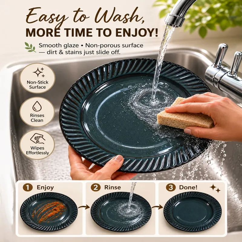 Dark blue glossy plate being rinsed under running water in a kitchen sink