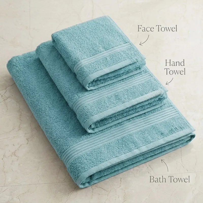 Folded mint bath, hand and face towels stacked together