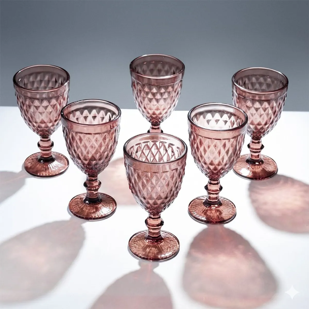 Set of six pink textured stemmed wine glasses