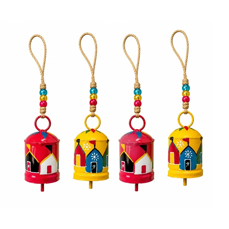 Front view of four painted hanging bells with rope loops on white background