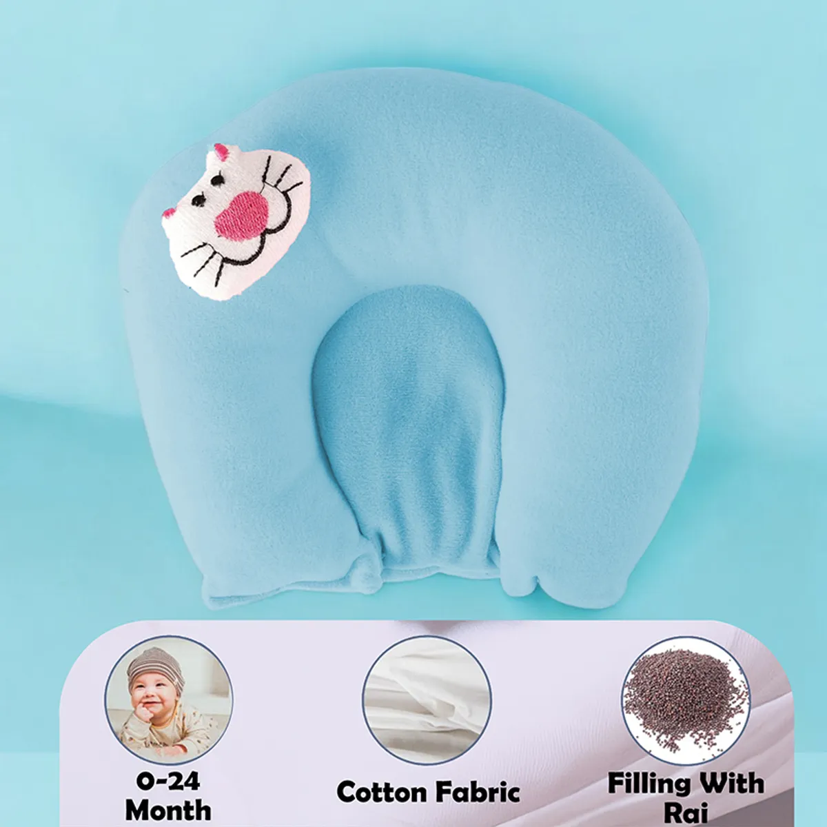 Blue baby neck pillow with cat face patch against a blue background