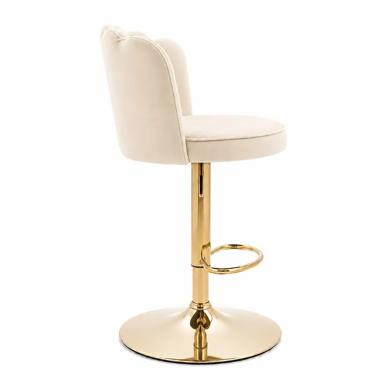 Side view of a beige velvet bar chair with gold-tone metal pedestal base