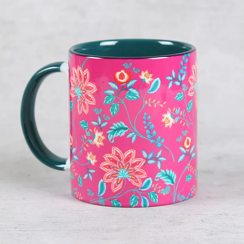 Single pink floral mug with teal handle and interior