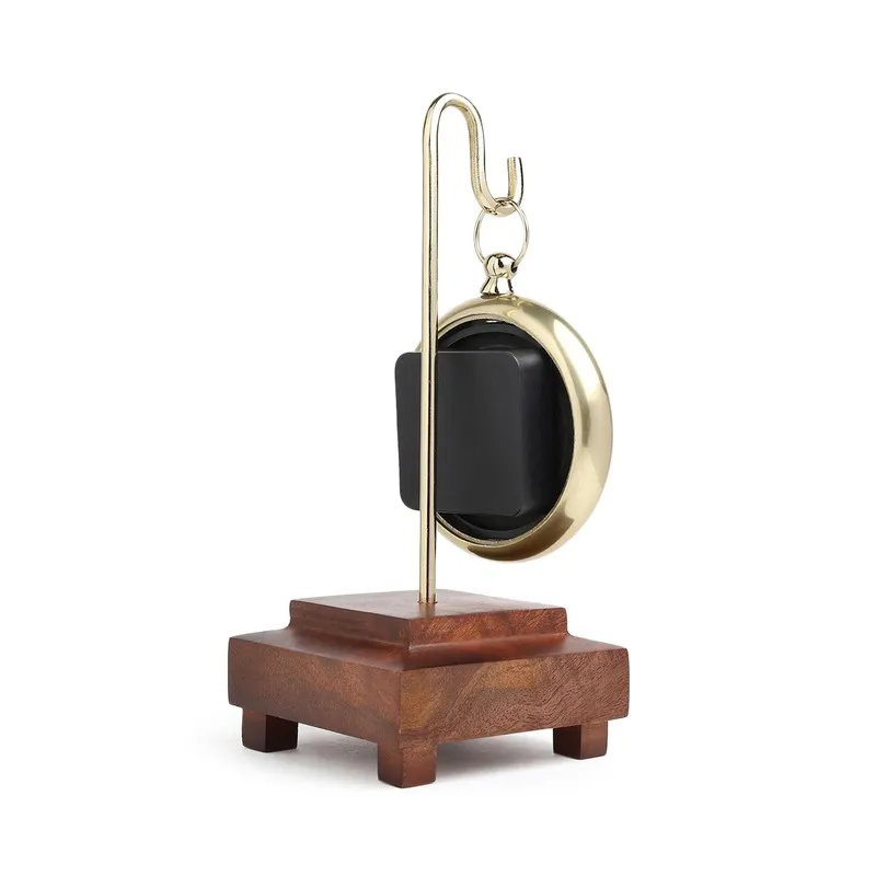 Rear view of the table clock showing the back casing and wooden base