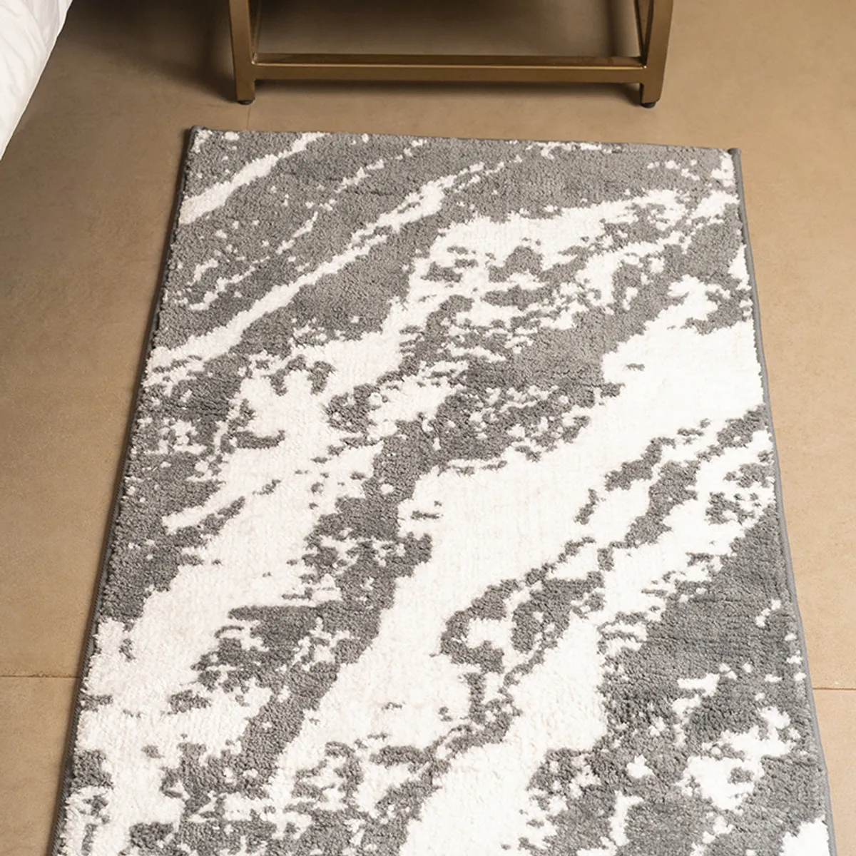 Close view of the grey and white abstract runner rug