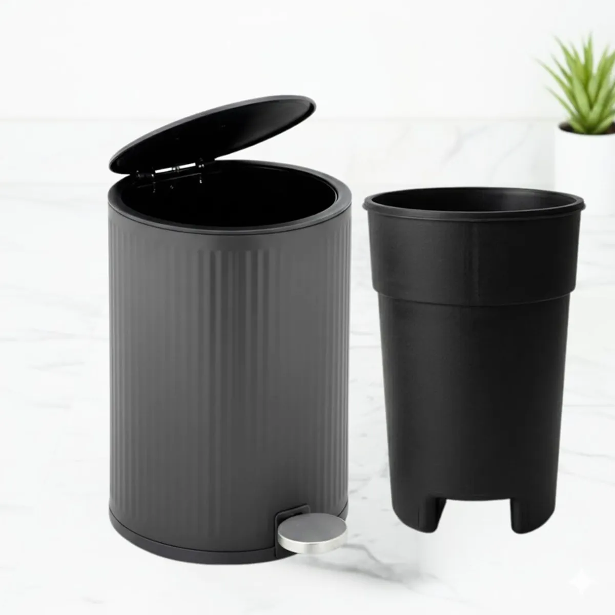 Grey pedal dustbin with removable black inner bucket beside it