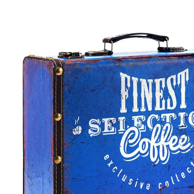 Close-up of blue canvas storage trunk with distressed print and studded edges
