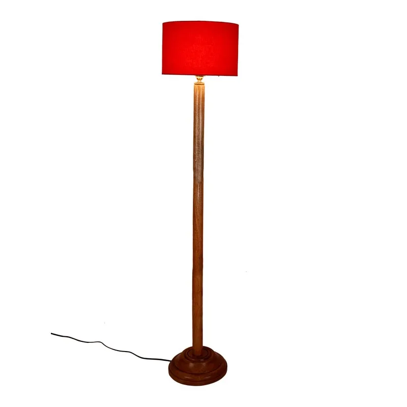 Front view of wooden floor lamp with red drum shade on a white background